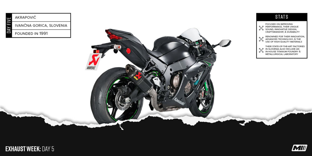 An all-black Kawasaki Ninja motorcycle with green accents sports an Akropovic exhaust