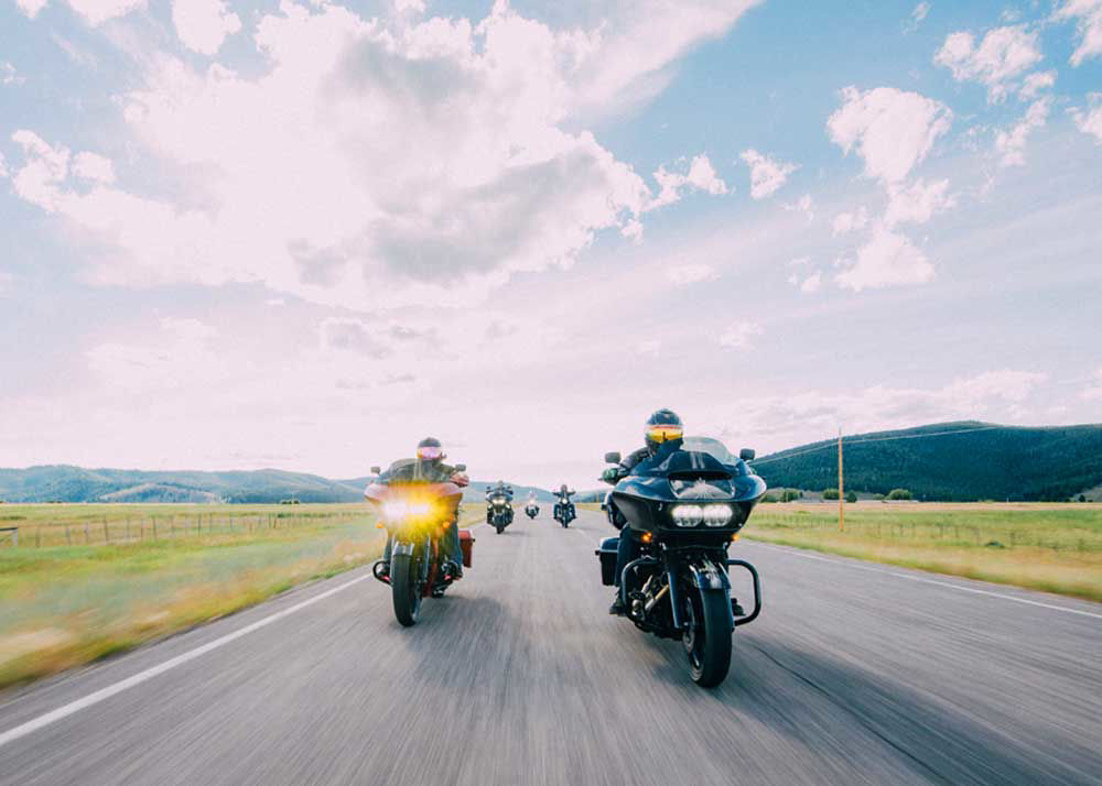 Group of motorcyclists riding on the open road