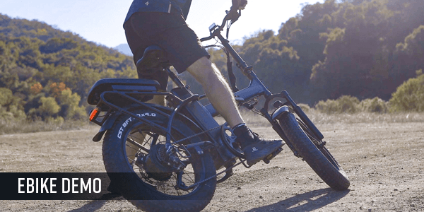 Person riding off-road on a black electric bike