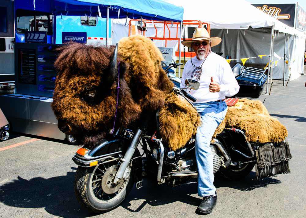 Man sitting on a motorcycle that looks like a bison