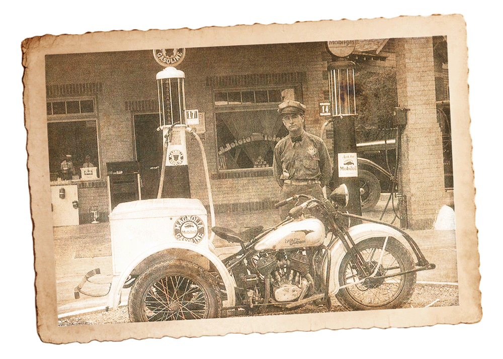 An old photo depicting a Harley-Davidson Servi-car