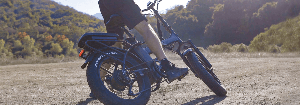 Male riding a Rattan eBike in the dirt