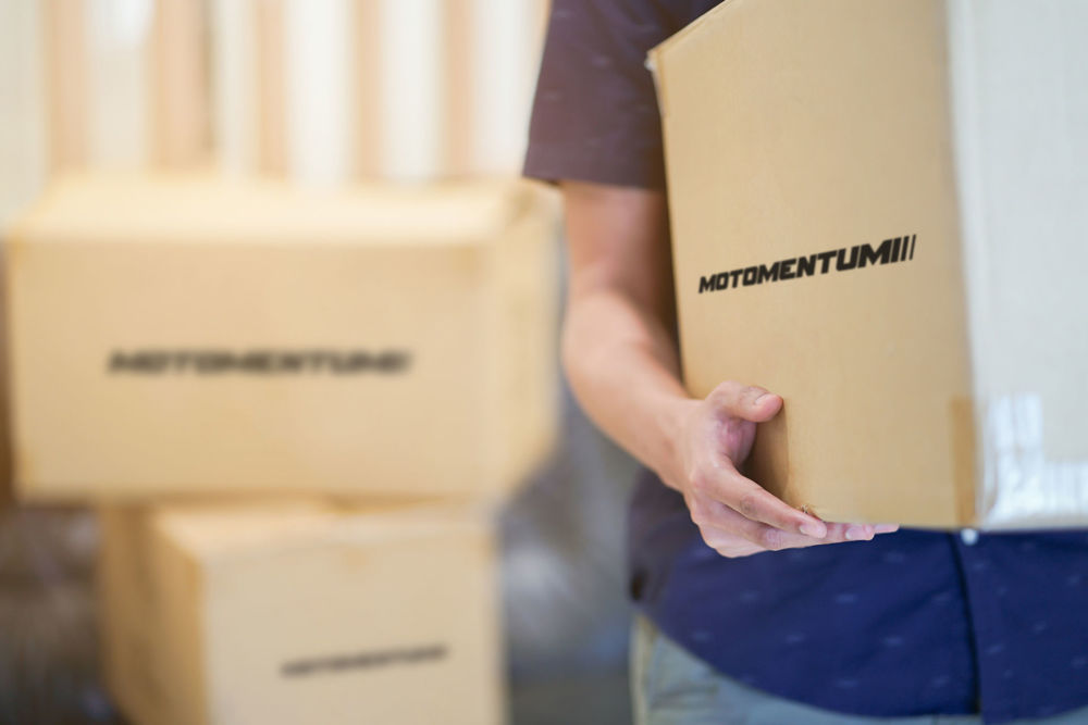 image of Motomentum packages delivered to a customer's front door